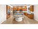 Gourmet kitchen with stainless steel appliances, granite countertops, and wood cabinets at 2694 Caumsett Ct, Las Vegas, NV 89117