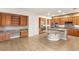 Open kitchen featuring stainless steel appliances, granite counters, hardwood floors, and custom cabinetry at 2694 Caumsett Ct, Las Vegas, NV 89117