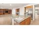 Kitchen with hardwood floors, granite countertops, stainless steel appliances, and wood cabinets at 2694 Caumsett Ct, Las Vegas, NV 89117