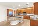 Open kitchen with granite countertops, stainless steel appliances, and wood cabinets at 2694 Caumsett Ct, Las Vegas, NV 89117