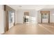 Spacious living room with a fireplace, windows, and hardwood flooring at 2694 Caumsett Ct, Las Vegas, NV 89117