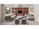 Virtually staged living room with hardwood floors and built-in shelves at 2694 Caumsett Ct, Las Vegas, NV 89117