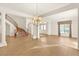 Bright living room featuring hardwood floors, columns, and staircase at 2694 Caumsett Ct, Las Vegas, NV 89117