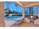 Back patio area with built-in BBQ, bar seating and pool, perfect for outdoor entertaining at 2694 Caumsett Ct, Las Vegas, NV 89117
