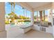 Outdoor kitchen with built-in barbecue, sink, counter space and view to the pool at 2694 Caumsett Ct, Las Vegas, NV 89117