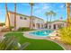 Lush backyard features a sparkling pool, spa, and meticulously manicured lawn for outdoor enjoyment at 2694 Caumsett Ct, Las Vegas, NV 89117