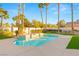 Luxurious pool and spa surrounded by lush landscaping, offering a serene backyard retreat at 2694 Caumsett Ct, Las Vegas, NV 89117