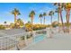 Beautiful rooftop view showcasing a sparkling pool, spa, and lush landscaping, perfect for outdoor living at 2694 Caumsett Ct, Las Vegas, NV 89117