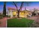 Backyard patio with seating and a mature tree at 2817 Billy Casper Dr, Las Vegas, NV 89134
