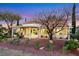 Beautiful backyard featuring mature landscaping, covered patio, and outdoor seating area at 2817 Billy Casper Dr, Las Vegas, NV 89134