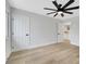 View of bedroom features a window and doors to adjacent bathroom and hall at 2817 Billy Casper Dr, Las Vegas, NV 89134