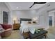 Spacious bedroom with a ceiling fan, sitting area and view of the outdoors at 2817 Billy Casper Dr, Las Vegas, NV 89134
