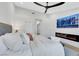 This bedroom includes a king size bed, fireplace and a mounted television at 2817 Billy Casper Dr, Las Vegas, NV 89134