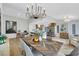 Bright dining room features an elegant chandelier, stylish table, and an open floor plan at 2817 Billy Casper Dr, Las Vegas, NV 89134