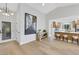 Welcoming foyer showcasing hardwood floors, a front door with sidelights, and a view into the open-concept kitchen at 2817 Billy Casper Dr, Las Vegas, NV 89134