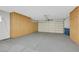 Clean garage with built in storage cabinets and a white paneled door at 2817 Billy Casper Dr, Las Vegas, NV 89134