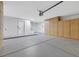 Spacious garage featuring ample storage cabinets and clean, painted concrete floors at 2817 Billy Casper Dr, Las Vegas, NV 89134