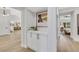 Hallway features modern cabinets, stylish decor, and seamless transition into the kitchen area at 2817 Billy Casper Dr, Las Vegas, NV 89134
