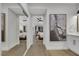 Hallway with mirrored closet, leading to a spacious bedroom with ample natural light at 2817 Billy Casper Dr, Las Vegas, NV 89134