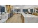 Bright kitchen with stainless steel appliances, a large island, and white countertops with a window view to the rear of the property at 2817 Billy Casper Dr, Las Vegas, NV 89134