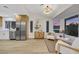 Modern living area with stainless steel appliances, bright interior and beautiful outdoor views at 2817 Billy Casper Dr, Las Vegas, NV 89134
