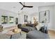 Open living room with neutral tones, gray sofa, and stylish decor at 2817 Billy Casper Dr, Las Vegas, NV 89134