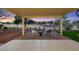 Relaxing covered patio area with outdoor seating and views of the golf course at 2817 Billy Casper Dr, Las Vegas, NV 89134