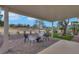 Comfortable covered patio area with stylish outdoor seating and views of the golf course at 2817 Billy Casper Dr, Las Vegas, NV 89134