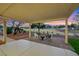 Relaxing covered patio area with outdoor seating and views of the golf course at 2817 Billy Casper Dr, Las Vegas, NV 89134