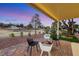 Comfortable covered patio area with stylish outdoor seating and views of the golf course at 2817 Billy Casper Dr, Las Vegas, NV 89134