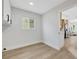 Bright room with hardwood floor, white wall, door and window at 2817 Billy Casper Dr, Las Vegas, NV 89134