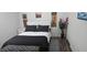 Well-decorated bedroom with a queen bed, stylish decor, and a neutral color palette at 330 N 9Th St, Las Vegas, NV 89101
