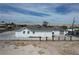 Exterior view of a white home with a gray roof and fenced yard at 330 N 9Th St, Las Vegas, NV 89101
