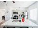 Bright kitchen with stainless steel appliances, quartz countertops, and a large center island with a sink at 330 N 9Th St, Las Vegas, NV 89101