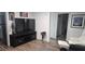 Cozy living area with a TV, a leather recliner, and bathroom access at 330 N 9Th St, Las Vegas, NV 89101