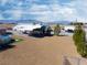 Aerial view of backyard with RV parking, desert landscaping, swimming pool, and mountain views at 340 Domingo St, Pahrump, NV 89048