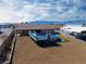 Aerial view of backyard with an above ground pool, parking and desert landscaping at 340 Domingo St, Pahrump, NV 89048