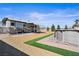 Backyard featuring RV parking, desert landscaping and artificial turf at 340 Domingo St, Pahrump, NV 89048