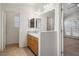 Bathroom features neutral walls, tile flooring, and wood cabinets at 340 Domingo St, Pahrump, NV 89048