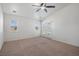 Bright primary bedroom with carpet flooring, neutral walls, ceiling fan, and a glass door leading to the outside at 340 Domingo St, Pahrump, NV 89048