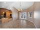 Open dining room with chandelier, tile floors, and easy access to the backyard at 340 Domingo St, Pahrump, NV 89048