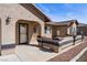 Inviting covered front entrance with decorative benches and warm stucco facade at 340 Domingo St, Pahrump, NV 89048