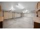 Spacious garage with a workbench, storage cabinets, and room for multiple vehicles at 340 Domingo St, Pahrump, NV 89048