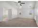 Bright main bedroom with plush carpet, natural light, and an attached bathroom at 340 Domingo St, Pahrump, NV 89048