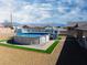 Above-ground pool, deck, and desert view add a luxurious touch to this backyard space at 340 Domingo St, Pahrump, NV 89048