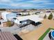 An RV is parked under a large metal awning, offering plenty of covered space at 340 Domingo St, Pahrump, NV 89048