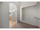 This walk-in closet features an arched entryway and built-in shelving at 340 Domingo St, Pahrump, NV 89048