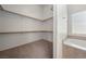 Spacious walk-in closet with ample shelving and storage space, located next to a bathtub at 340 Domingo St, Pahrump, NV 89048