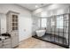 A luxurious bathroom with a freestanding tub, a glass-enclosed shower, and elegant fixtures at 3465 Pama Ln, Las Vegas, NV 89120