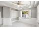 A light-filled room with built-in shelves and a large window, creating a versatile and inviting space at 3465 Pama Ln, Las Vegas, NV 89120